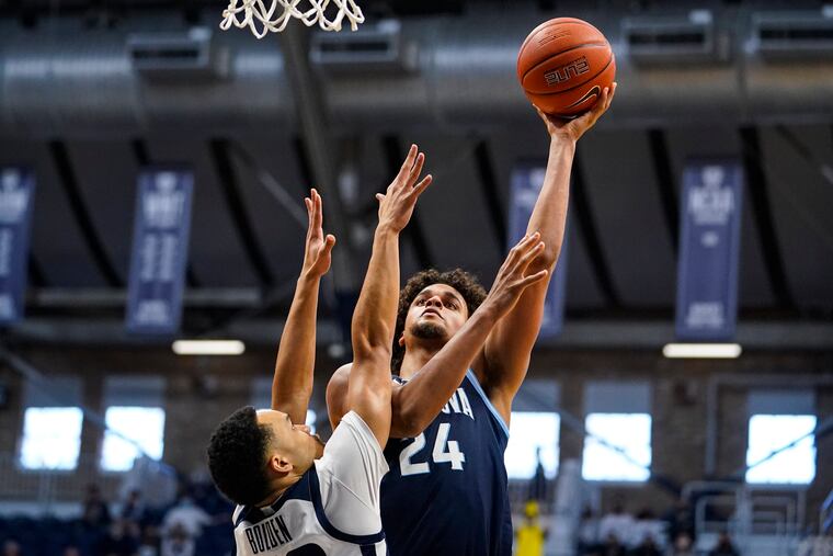Villanova forward Jeremiah Robinson-Earl (24) shoots over Butler guard Jair Bolden (52) in the first half of an NCAA college basketball game in Indianapolis, Sunday, Feb. 28, 2021. (AP Photo/Michael Conroy)
