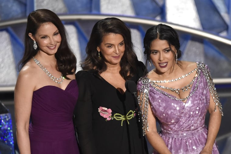 Ashley Judd, from left, Annabella Sciorra and Salma Hayek speak at the Oscars on Sunday, March 4, 2018.