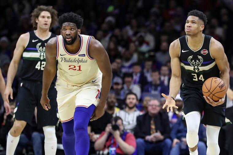 Giannis Antetokounmpo reacts after he is called for a foul against Joel Embiid in the second quarter of a game at the Wells Fargo Center in South Philadelphia on Wednesday, Dec. 25, 2019. Sixers won, 121-109.