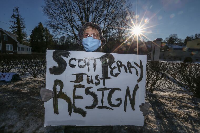 Pamela Hunter, of Cumberland County, protests Rep. Scott Perry near Perry's office in Wormleysburg on Friday.