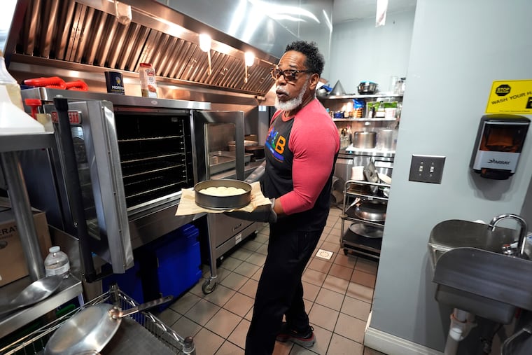 Small business owner Michael Hooks works in the kitchen of his catering business in Erie, Pa. Friday, Nov. 1, 2024. (AP Photo/Gene J. Puskar)
