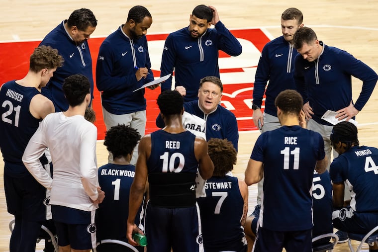 Penn State coach Mike Rhoades huddles with his team during a game on Feb. 21.