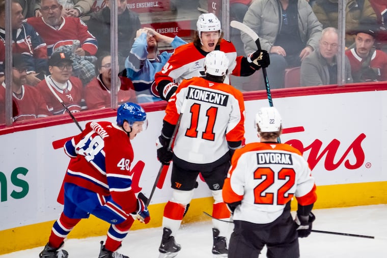 Flyers' Trevor Zegras (46) celebrates his second-period goal with teammates Travis Konecny and Christian Dvorak against Montreal.