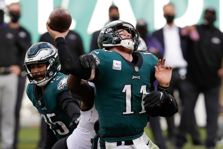 Eagles quarterback Carson Wentz getting taken down by Baltimore Ravens outside linebacker Matt Judon during the fourth quarter on Sunday.