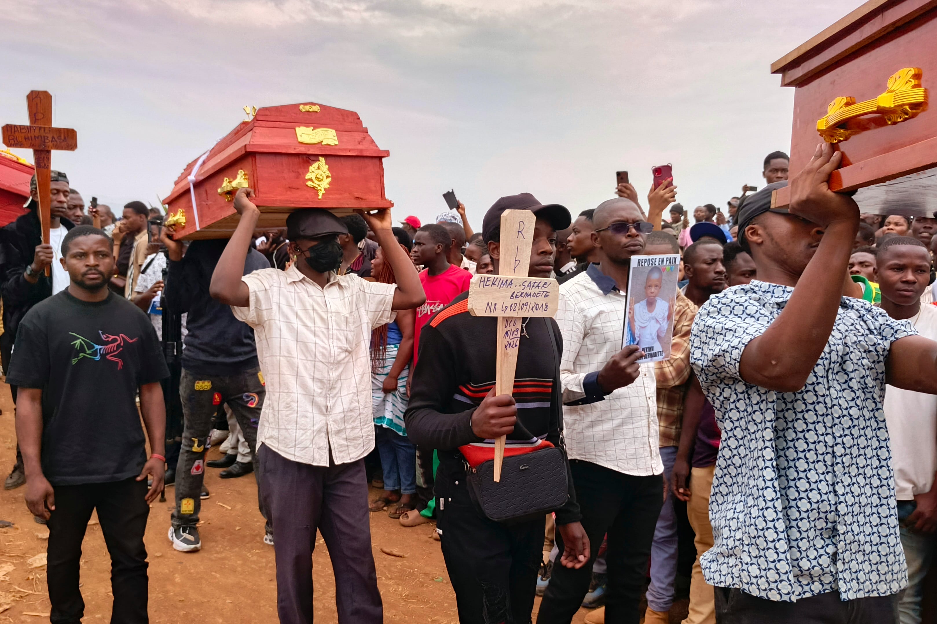 Hundreds gather in eastern Congo to mourn victims of school fires