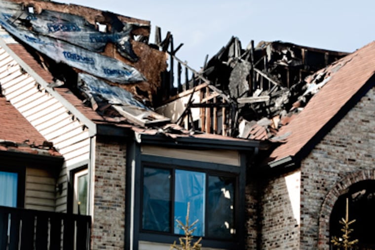 A structure at 4700 Dunbarton Rd., Mt. Laurel, was severely burned in an overnight fire. (David M Warren / Staff Photographer)