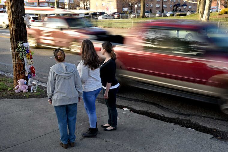 Danny Dimitri's sister Cheryl Dimitri Prosinski (left) and her daughters, Stephanie Prosinski, (center), and Brittany Prosinski, (right) visit his memorial on Cottman Ave. March 21, 2017. A Northeast Philadelphia chef, Danny Dimitri was killed by an off-duty police officer on the way home from the gym.