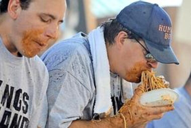 Royersford native "Humble" Bob Shoudt scarfs down Cincinnati chili on his way to a title this weekend.