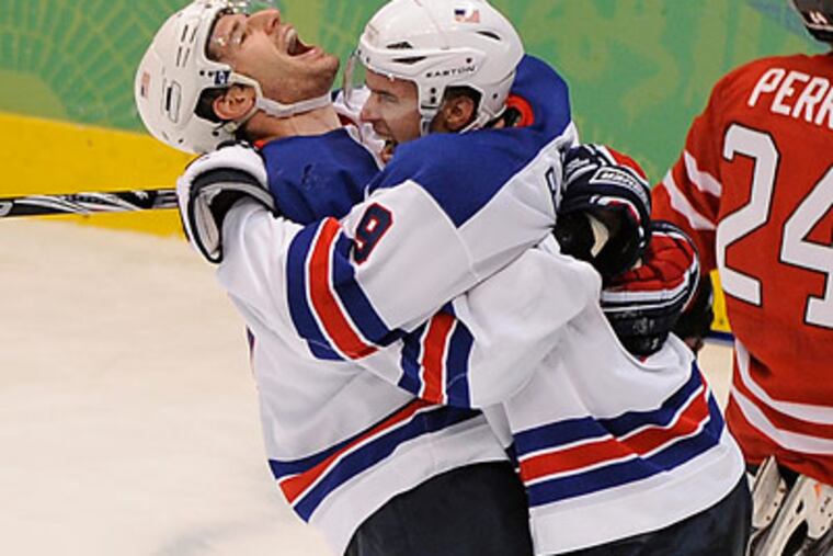 Ryan Kesler (left) scored the goal that sealed the United States' win. (Clem Murray/Staff Photographer)