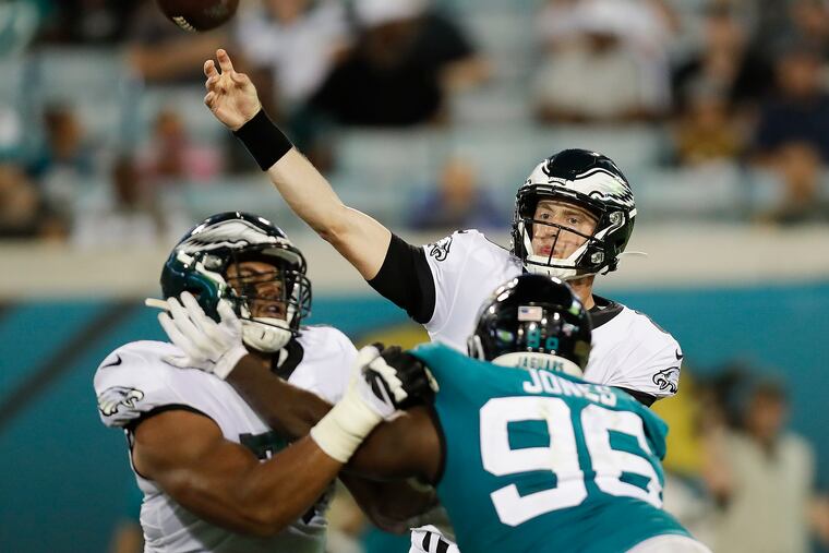 Eagles tackle Andre Dillard blocks the Jaguars' Datone Jones as quarterback Clayton Thorson throws a pass Thursday.