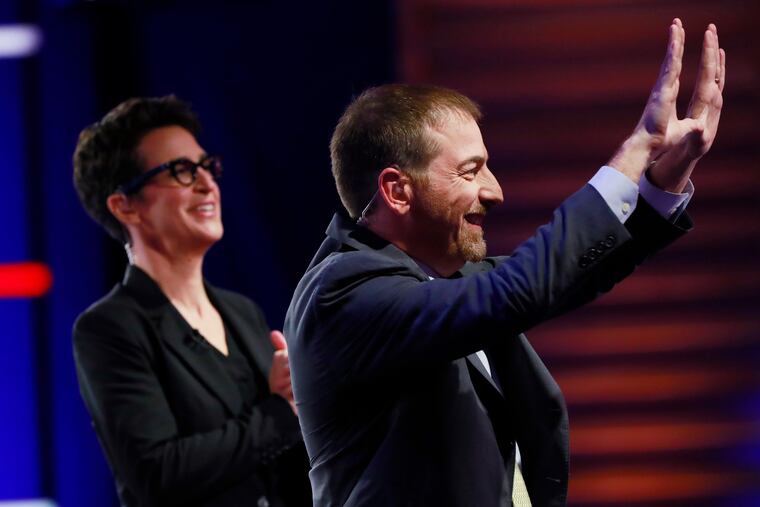 Chuck Todd, NBC News Political Director, and Rachel Maddow, MSNBC host, call for a pause during a Democratic primary debate hosted by NBC News at the Adrienne Arsht Center for the Performing Art, Wednesday, June 26, 2019, in Miami. (AP Photo/Wilfredo Lee)