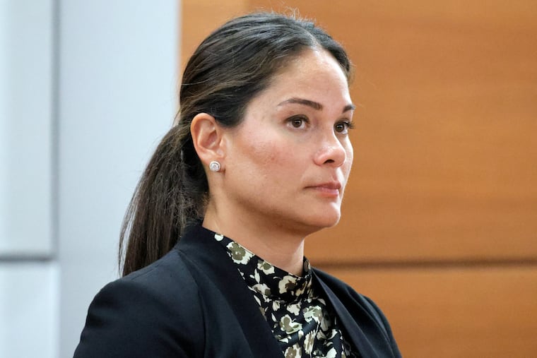 Melina Hipskind, from McDonalds USA, stands at the defense table as a verdict awarding Philana Holmes and Humberto Caraballo Estevez $800,000 on behalf of their daughter Olivia Caraballo, now 8, is read at the Broward County Courthouse in Fort Lauderdale on Wednesday.