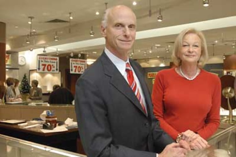 Standing behind the counter of the Jack Kellmer Co. Haverford store are Jim Kellmer and Diane Kellmer Young. After 72 years in the diamond business, Jack Kellmer Co. is closing up shop. (Jonathan Wilson / Staff Photographer)