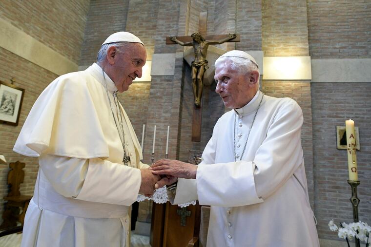 Pope Francis, left, and Pope Benedict XVI, meet each other on the occasion of the elevation of five new cardinals at the Vatican, on June 28, 2017.