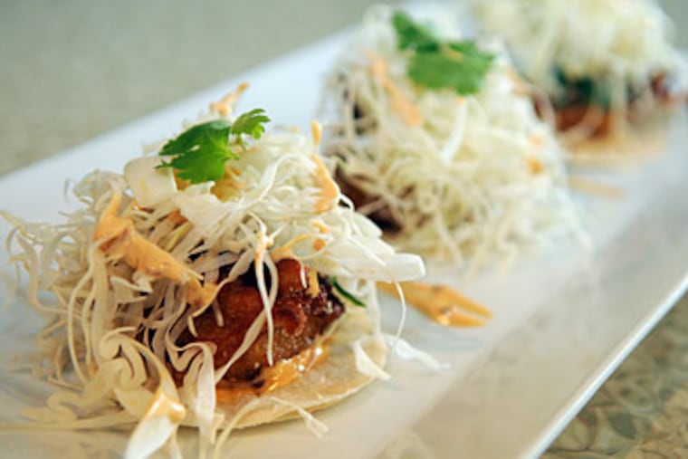 The fish tacos had a tasty, crunch coating. (SARAH J. GLOVER / Staff Photographer)