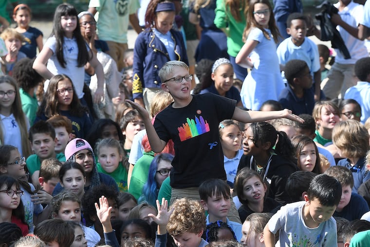 Students cheer during a gathering celebrating Greenfield Elementary's status as a U.S. Department of Education Blue Ribbon award winner. Locally, 11 schools received the honor. 348 schools nationwide won the prize.