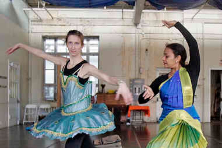 Amanda Miller (left), a ballerina from Miro Dance Theatre, rehearses with Viji Rao, who performs Bharatanatyam (South Indian classical dance).