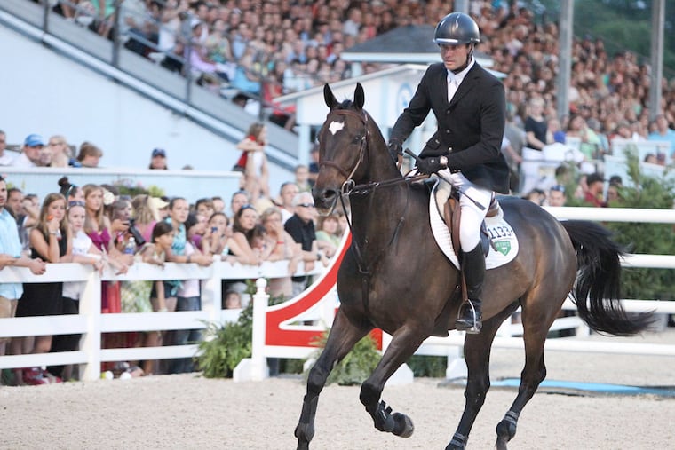 Devin Ryan ridding "No Worries" finished third at the Wells Fargo Grand Prix of Devon at the Devon Horse Show, Thursday, May 30, 2013. (Steven M. Falk/Staff Photographer)