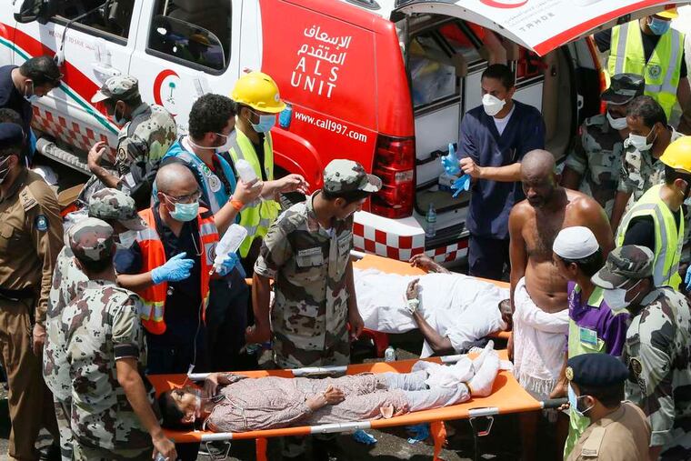 Emergency workers attend to victims crushed in a stampede in Mina, Saudi Arabia. The disaster resulted when two giant crowds collided at an intersection.