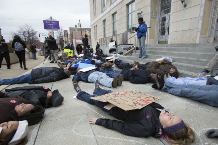 More than 50 clergy, members of faith communities and allies across South Jersey gathered Friday morning on the steps of the Camden Federal Courthouse to call attention to the need for change in policing practices and investigations. (Ed Hille / Staff Photographer)