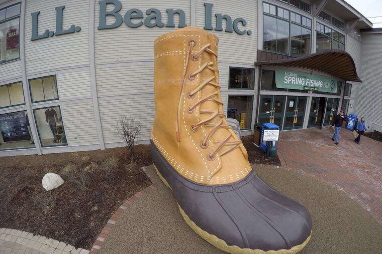 Shoppers exit the L.L. Bean retail store in Freeport, Maine. L.L. Bean is tightening its generous return policy by imposing a one-year limit on most returns to reduce abuse and fraud. Executives say returns of severely worn items have doubled over five years. Under the new policy announced Friday, Feb. 9, 2018, the company will accept returns for one year with a proof of purchase and will continue to replace products for manufacturing defects beyond that.