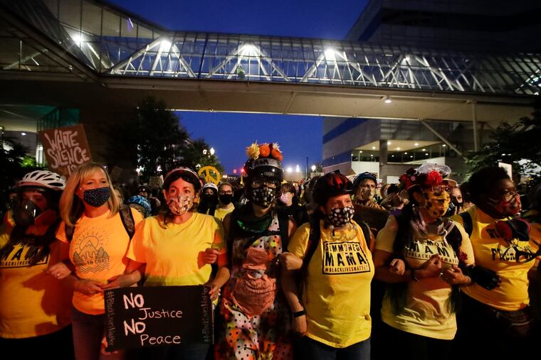 Demonstrators march during a Black Lives Matter protest Friday in Portland, Ore.