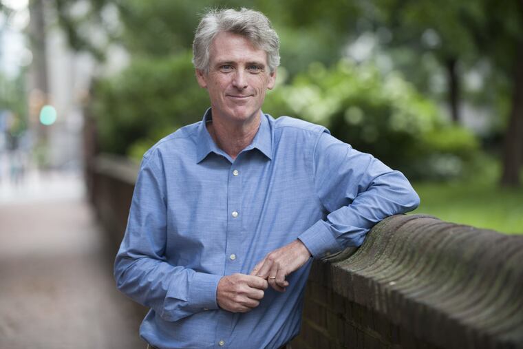 Philadelphia Magazine editor Tom McGrath stands outside of the magazine's new offices near Washington Square.