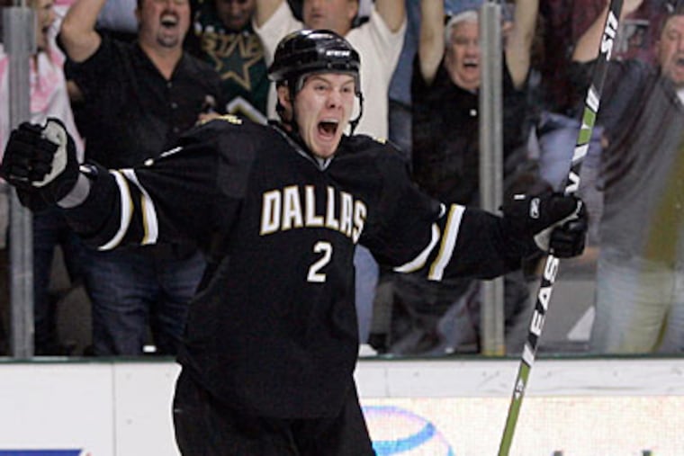 Nicklas Grossman has posted five assists and 26 penalty minutes with Dallas so far this year. (Tony Gutierrez/AP file photo)