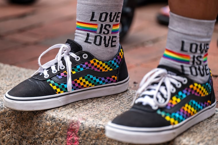 A spectator’s shoes along Walnut Street as the Pride March and Festival kicks off with a march from Washington Square Sunday, June 2, 2024, with the theme, “Be You.”
