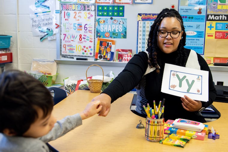 Student teacher Lana Scott, who plans to graduate from Bowie State University in the spring of 2023, teaches a small group of kindergartners at Whitehall Elementary School in Bowie, Md.