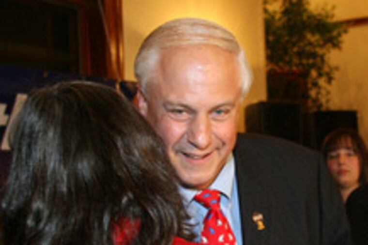 Al Taubenberger hugs wife, Joanne, before concession speech.