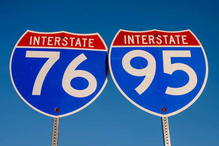 Interstate Highway signs for I-76 and I-95 decorate the parking lot for Xfinity Live! in March 2022.