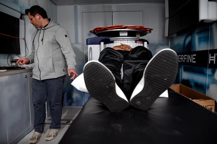 James Brown received his early detection brain tumor screening from Ethan Schnur at the Brain Tumor Foundation’s free mobile MRI unit parked at Triumph Baptist Church of Philadelphia in Hunting Park.