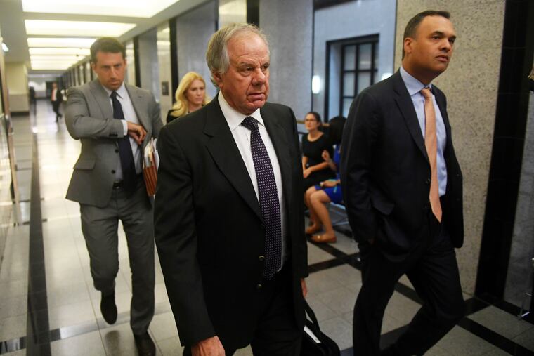 Attorneys Jack Goldberger, center, Alex Spiro, left, and William Burck, the defense team for New England Patriots owner Robert Kraft, make their way to Courtroom 2E at the Palm Beach County Courthouse, Friday, April 12, 2019, in West Palm Beach, Fla., for a status hearing in a prostitution case against Kraft.