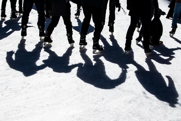 People skate along the Dilworth Park plaza ice rink in Philadelphia on Nov. 26.