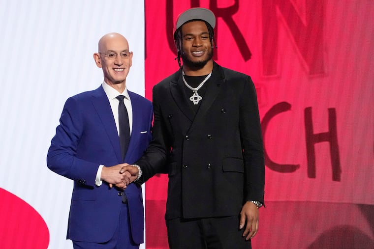 Cam Whitmore poses for a photo with NBA Commissioner Adam Silver after being selected 20th overall by the Houston Rockets.