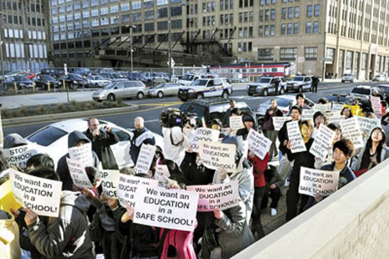 Students and community members walk up Broad Street to protest violence against Asians at South Philadelphia High School on Dec. 9, 2009. (Sarah J. Glover / Staff Photographer)