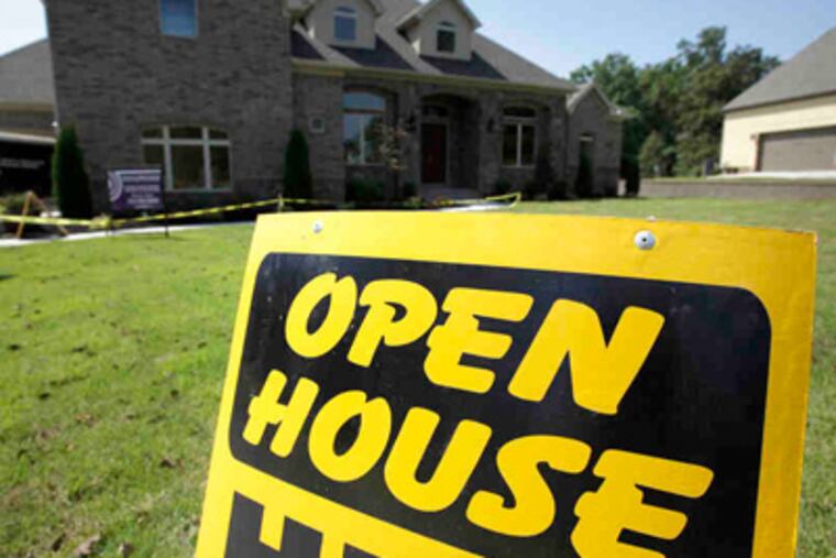 An open-house sign beckons to potential home buyers in Little Rock. Spring buying pushed prices higher in the second quarter. But the market remains shaky, and prices are still lower than in 2010. (Danny Johnston / AP)