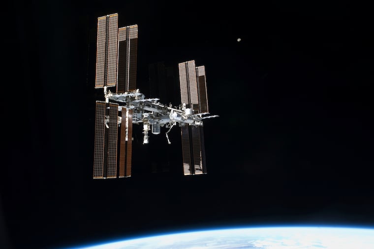 The International Space Station is seen from the space shuttle Atlantis in 2011: NASA cut short its latest mission because of a medical issue with one of the crew members.
