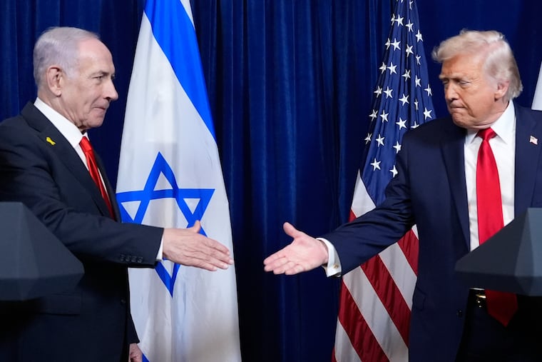 FILE - President Donald Trump shakes hands with Israel's Prime Minister Benjamin Netanyahu at the end of a news conference at Mar-a-Lago, Dec. 29, 2025, in Palm Beach, Fla.