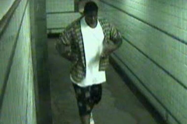 Police say this surveillance image shows the suspect in an assault on a woman in a Philadelphia subway station.