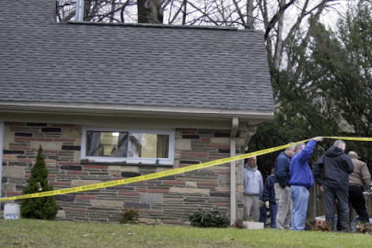 Police and Montgomery County Coroner officials at the home of murder victim Richard Porter in Wayne, Pa. on Friday. (Elizabeth Robertson / Staff Photographer)