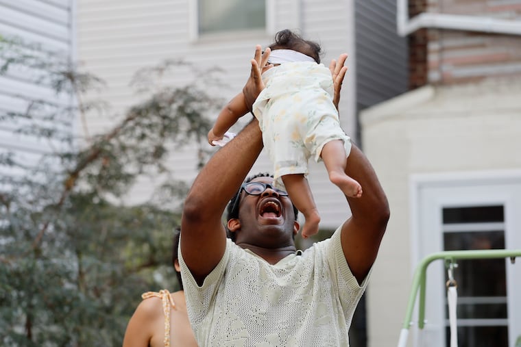 Christopher Johnson with Elysia Baskins’ daughter, Thursday, Sept. 3, 2026 in Philadelphia.