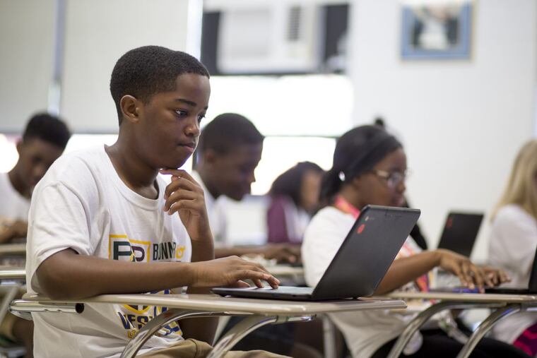 Shaun Jackson in class at the Summer Bridge Program for incoming ninth graders at Monsignor Bonner and Archbishop Prendergast Catholic High School in Drexel Hill last week. (MARGO REED / Staff Photographer )