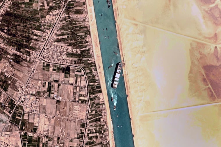 This satellite photo from Planet Labs Inc. shows the Ever Given cargo ship stuck in Egypt's Suez Canal Monday, March 29, 2021. Engineers on Monday "partially refloated" the colossal container ship that continues to block traffic through the Suez Canal, authorities said, without providing further details about when the vessel would be set free.