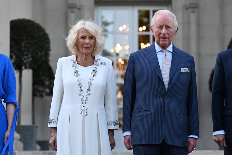 Britain's King Charles III and Queen Camilla arrive at a garden party at the British Embassy, Monday, April 27, 2026, in Washington.