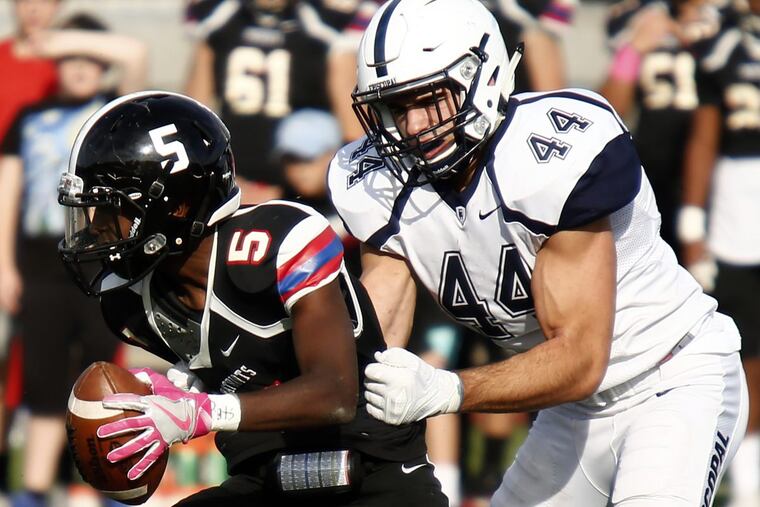 Episcopal Academy’s Milton Mamula sacks Germantown Academy’s Lacey Snowden, causing a fourth-quarter turnover.