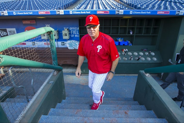 Pete Mackanin heads to batting practice on the day he was fired as manager.