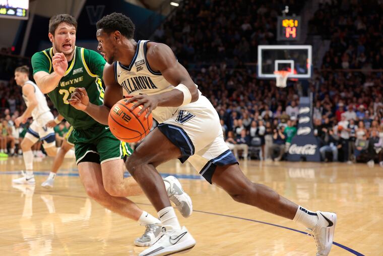 T.J. Bamba (right) of Villanova drives the baseline against Luke Sutherland of Le Moyne during the second half on Nov. 10, 2023 at the Finneran Pavilion at Villanova University.