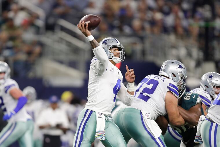 Dallas Cowboys quarterback Dak Prescott throws the football against the Eagles in October.